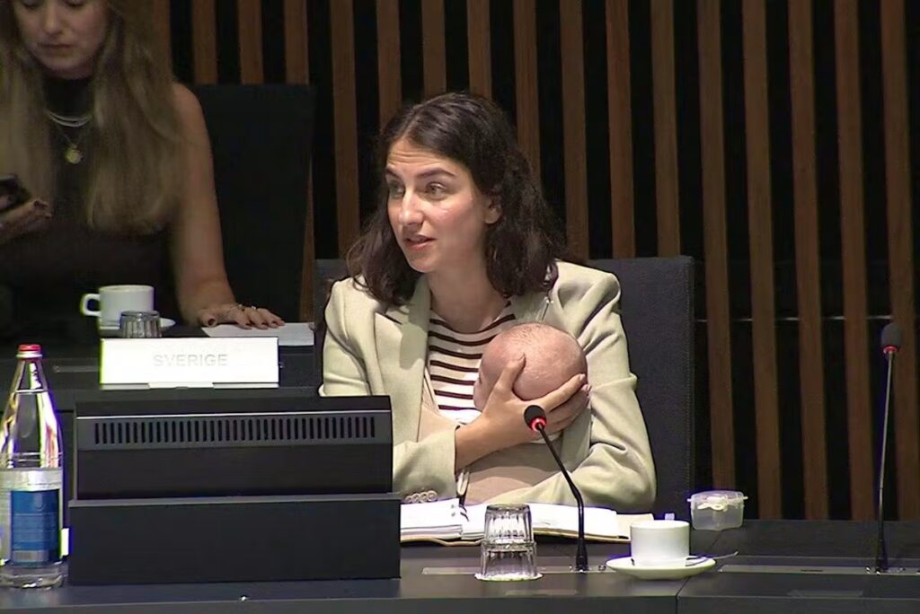 A minister comes with her baby to a European meeting