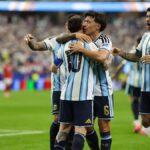 A record double from Messi qualifies Argentina for the round of 16