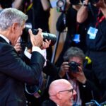 Clooney steals photographer’s camera, “annoyed” then amused